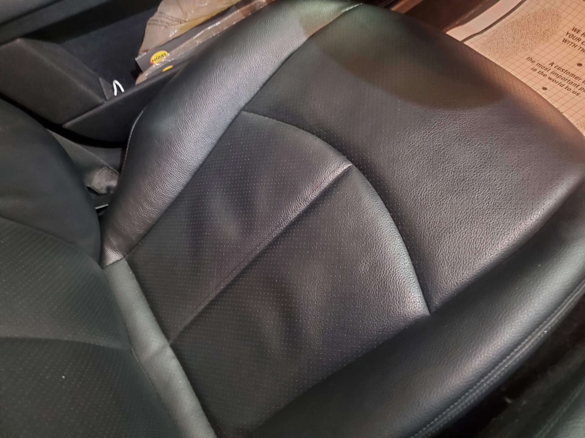 Front passenger leather seat restored with even tone and texture