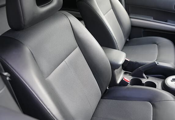 Front passenger leather seat restored with even tone and texture