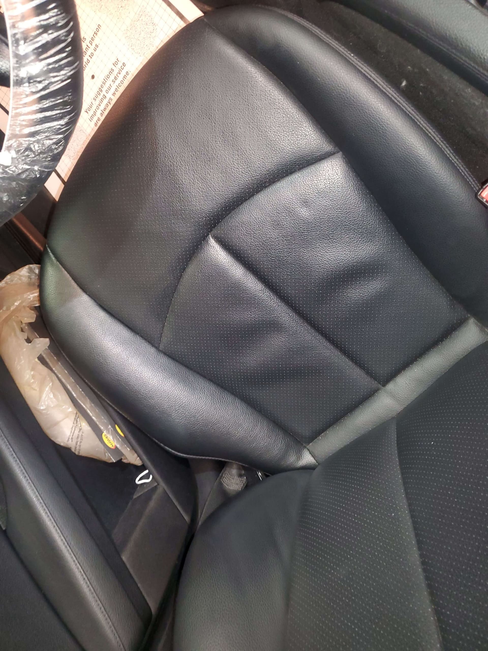 Driver seat leather panel after professional repair and refinishing