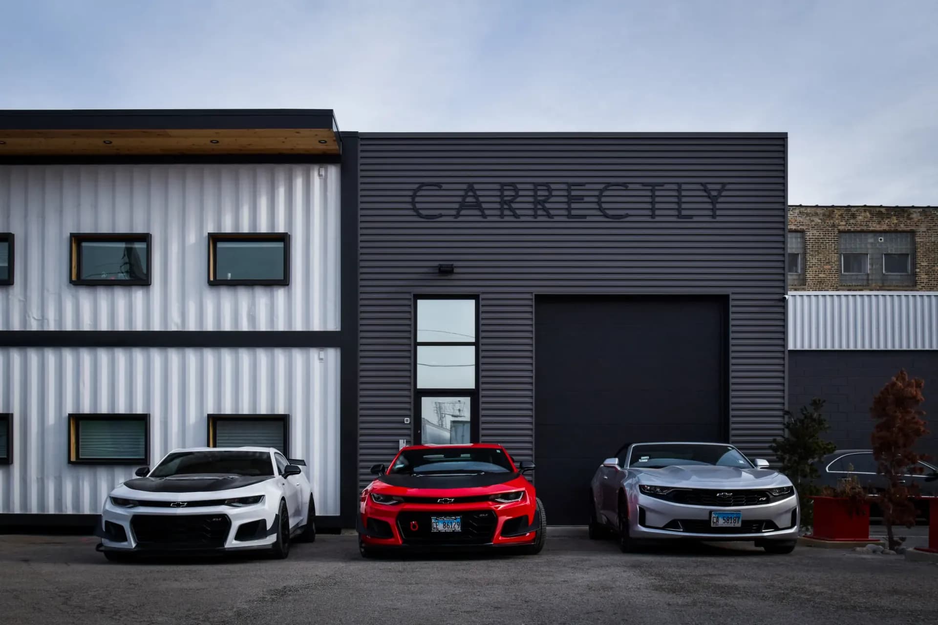 Chevrolet Camaros parked outside the Carrectly Auto Care facility in Chicago