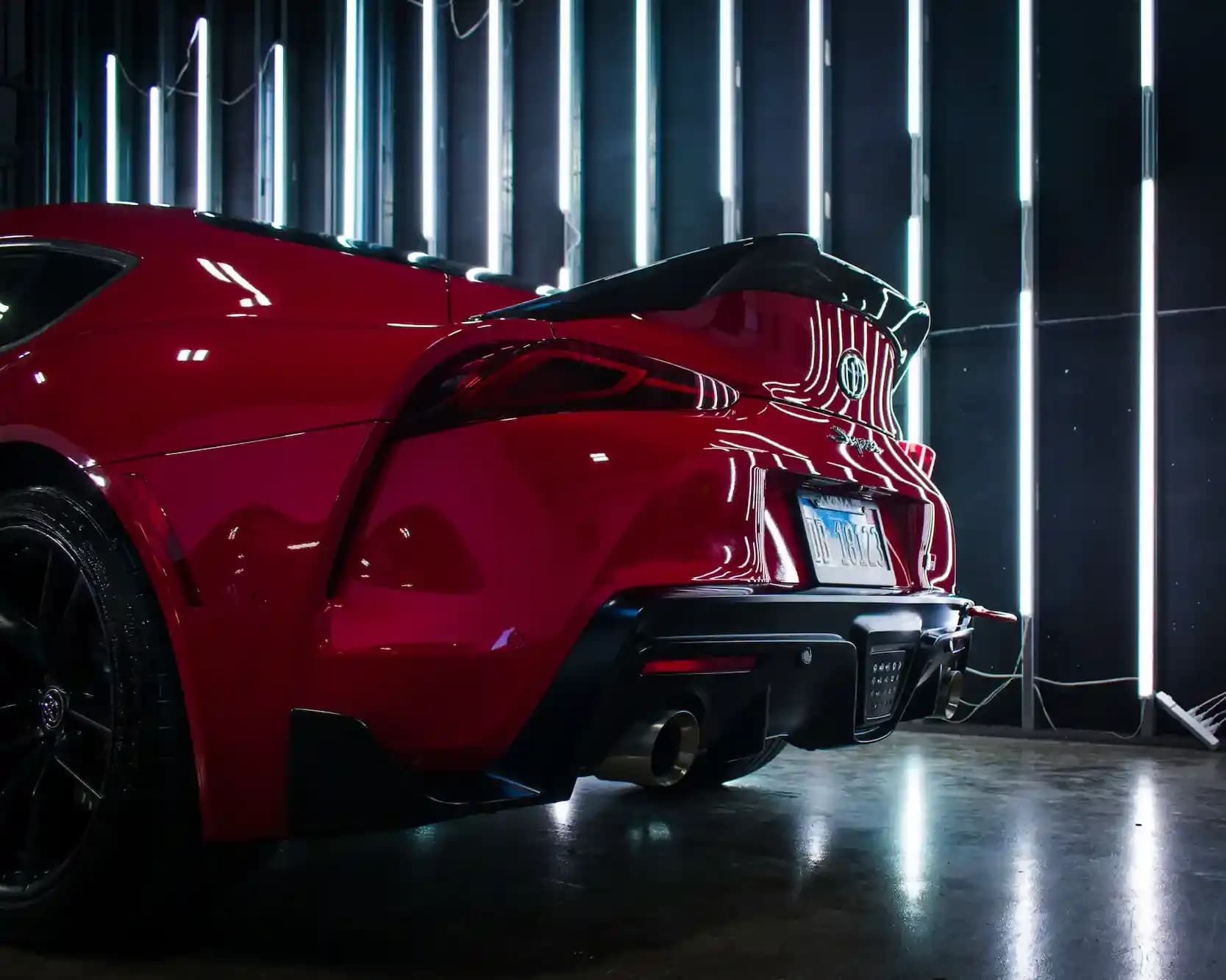 Red sports car rear with a durable 5-year ceramic coating glow