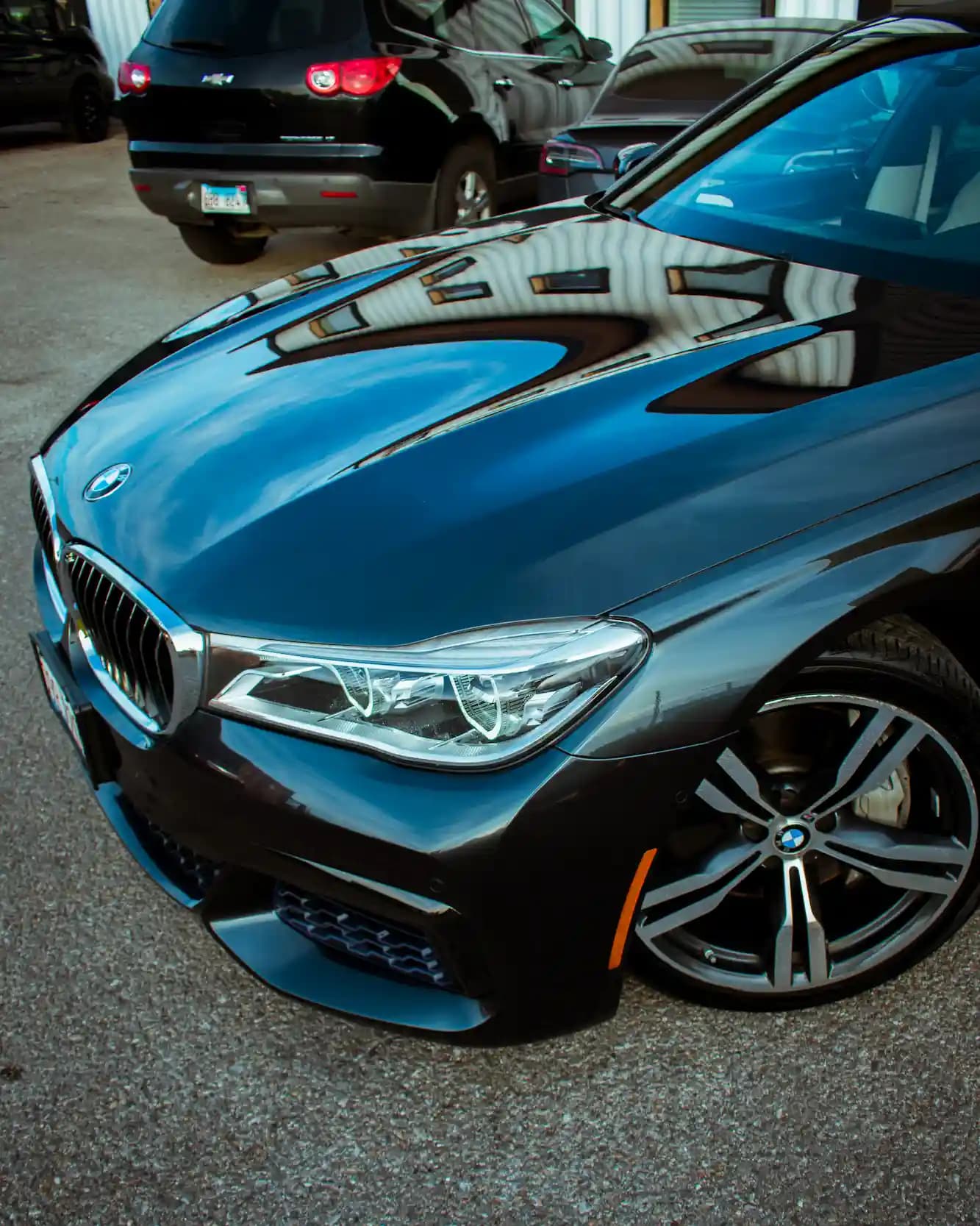 BMW sedan with a sleek, reflective surface after ceramic coating